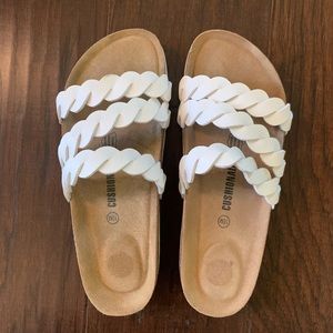 White Birkenstock-like sandals